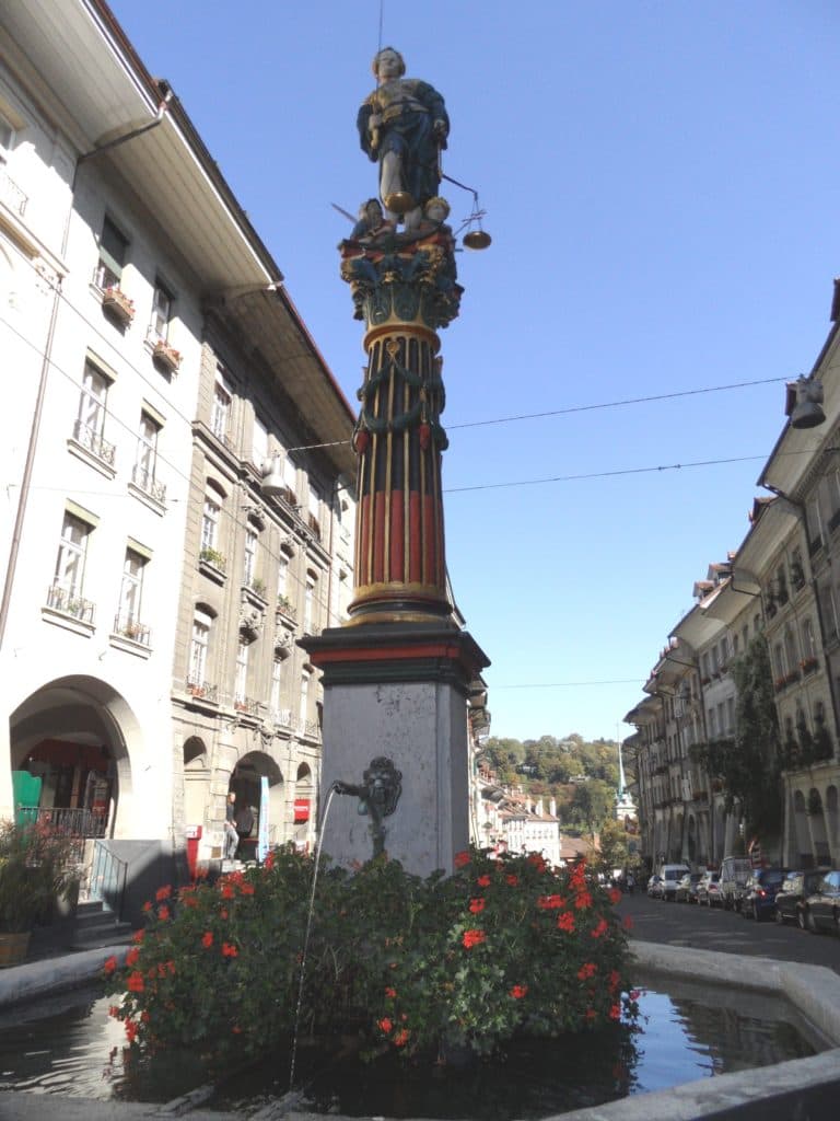 Fountain in Bern with a statue depicting a fairy tale.