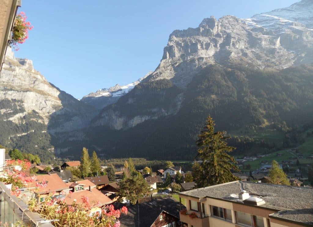 View from Hotel Belvedere in Grindelwald, overlooking the glacier and valley below on a luxury Swiss adventure.