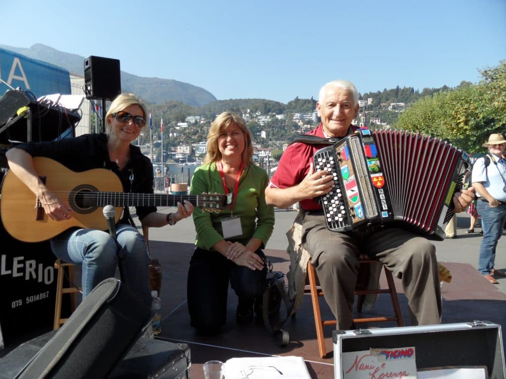 Sheila Cannon with father and daughter musicians at the Chestnut Festival on Lake Maggiore.