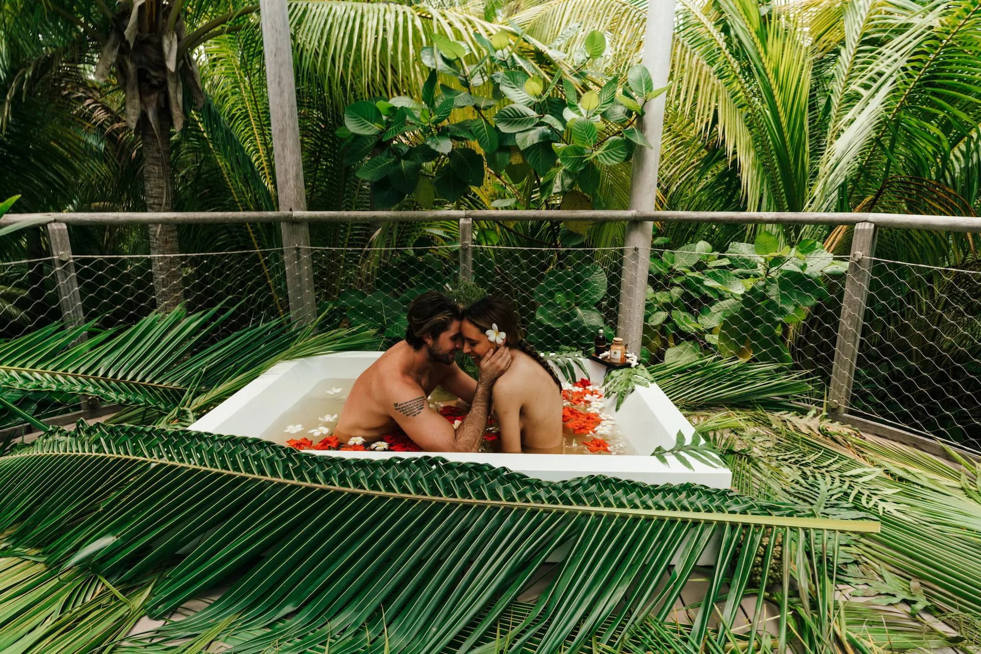 Romantic cuddle in a jacuzzi at Varua Te Ora Polynesian Spa.