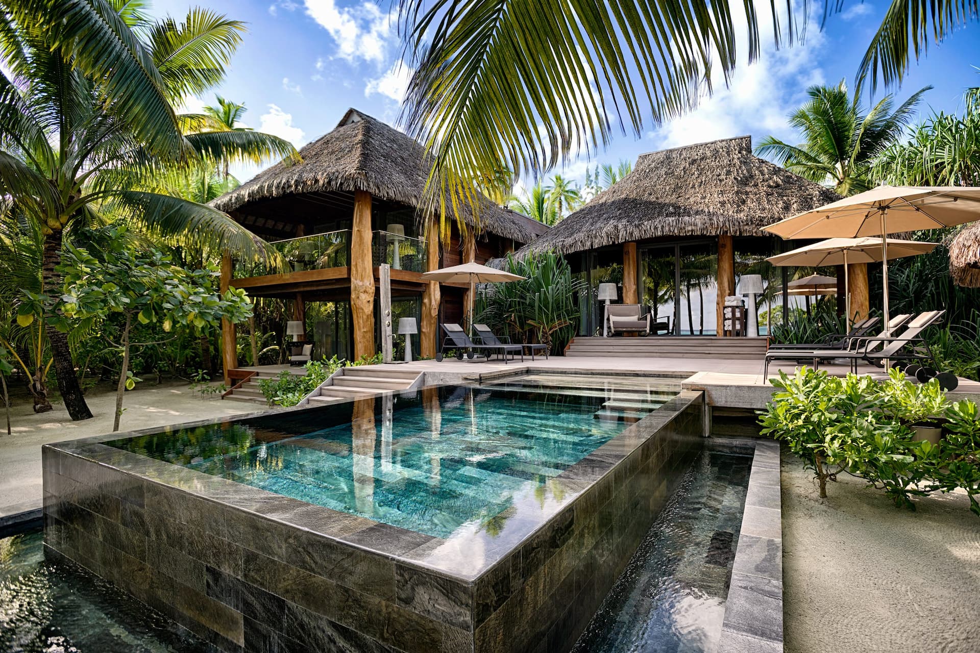 Exterior view of a beautifully designed 3-bedroom villa at The Brando, including a stunning plunge pool, showcasing Obama's find peace at The Brando Resort.