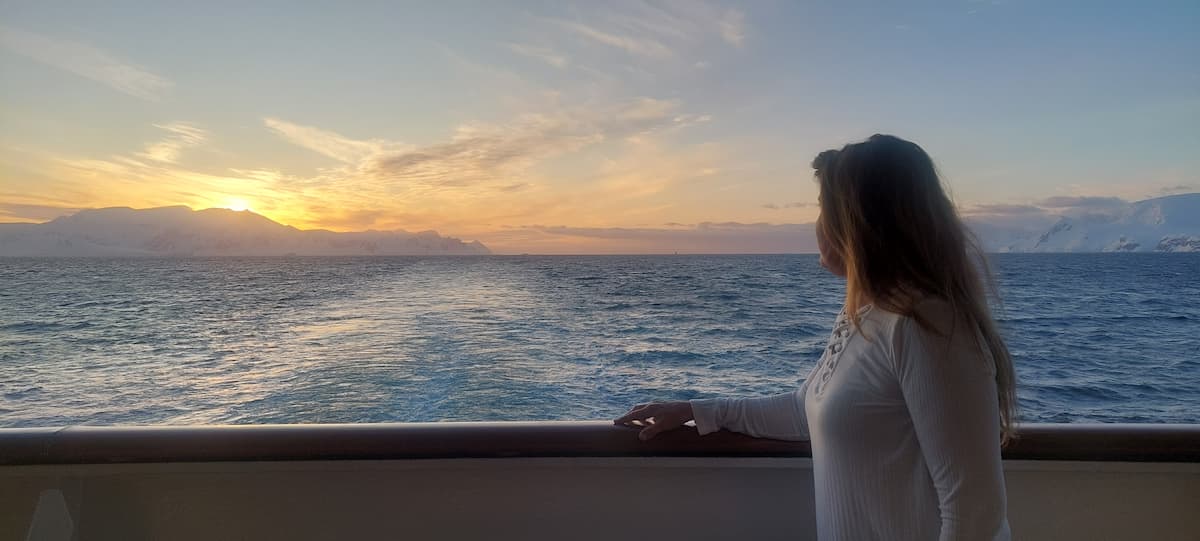 Antarctic landscape at sunset as seen from Ponant Le Boréal's aft during a luxury journey.