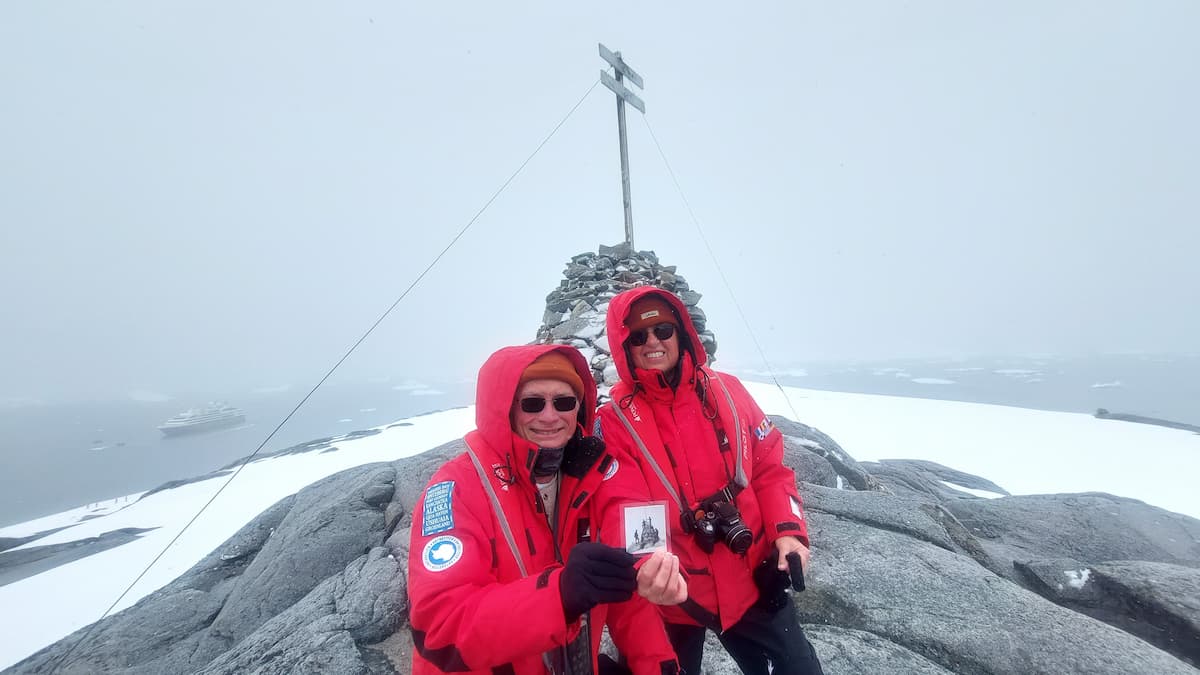 Historical exploration of Port Charcot in Antarctica with Ponant Le Boréal in the background.