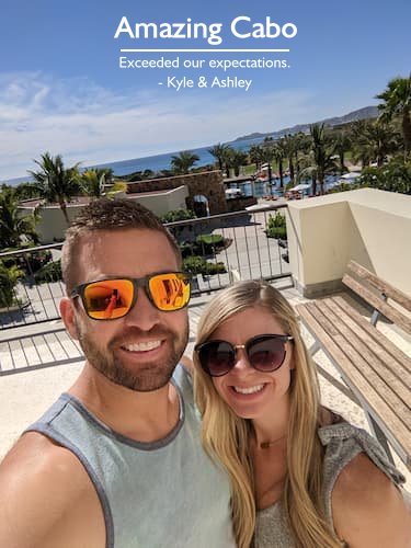 Couple enjoying their amazing Cabo trip with an ocean and resort view, planned by Sheila Cannon.