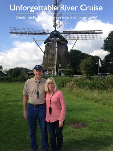 Couple in front of a windmill in the Netherlands during their unforgettable European river cruise, planned by Sheila.