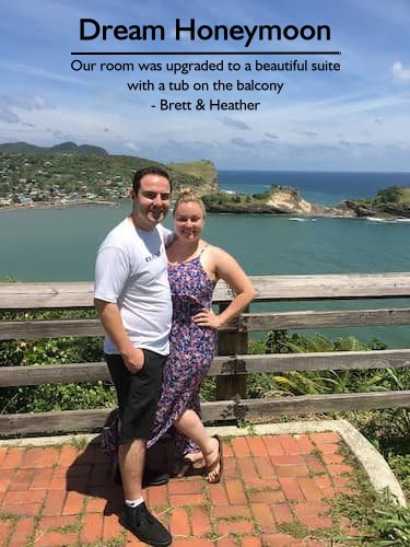 Smiling couple on a Caribbean overlook, enjoying their stress-free honeymoon planned by Sheila Cannon, featuring upgraded accommodations and perfect excursions.