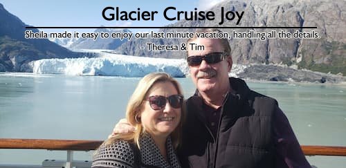 Smiling couple on the deck of a cruise ship with a glacier in the background, enjoying a last minute vacation planned by Sheila.