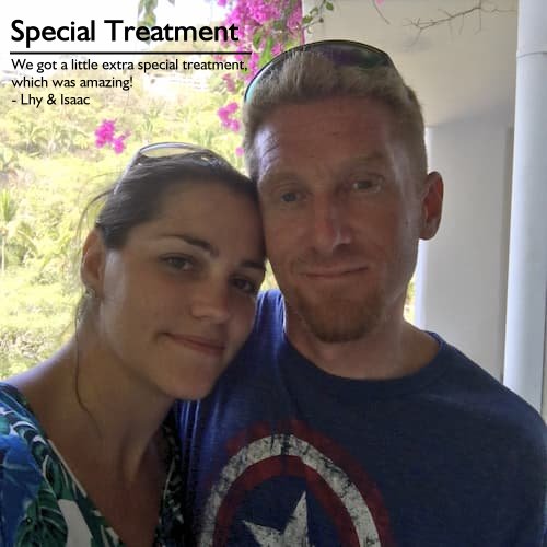 Couple at the resort with lush foliage and bougainvillea, enjoying special resort treatment on their dream vacation planned by Sheila Cannon.