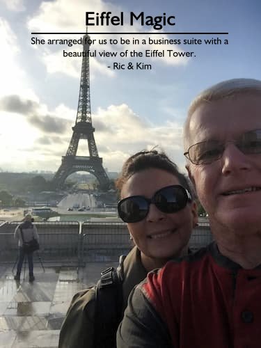 Smiling couple taking a selfie with the Eiffel Tower in Paris, showcasing Sheila's exceptional planning and special touches.