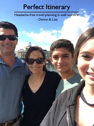 Family of four smiling in Switzerland with a river behind them during their headache-free European vacation planned by Sheila.