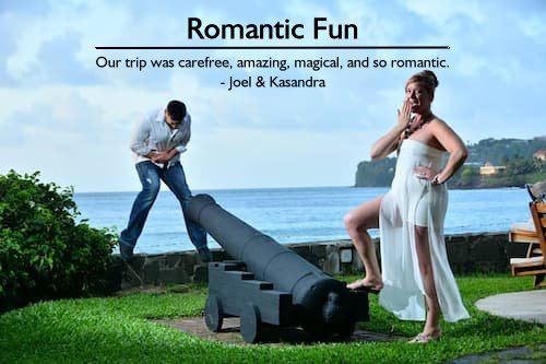 Fun couple posing with a cannon at an all-inclusive Sandals resort during their carefree romantic vacation planned by Sheila Cannon.