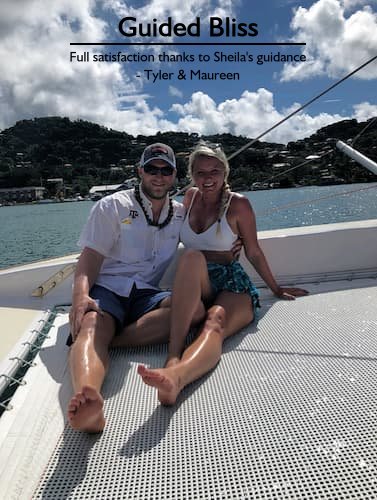 Best Sandals honeymoon travel agent | Tyler & Maureen on a catamaran with Grenada in the background