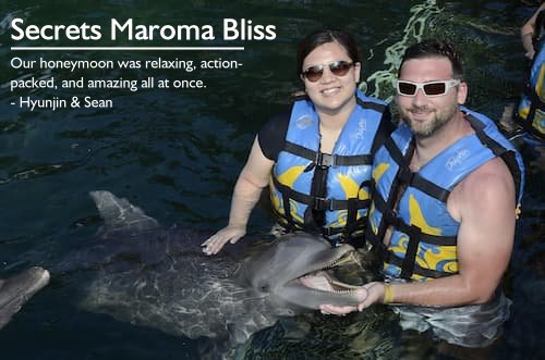 Couple on a dolphin excursion during their stress-free honeymoon at Secrets Maroma Beach, Riviera Maya, Mexico, planned by Sheila.