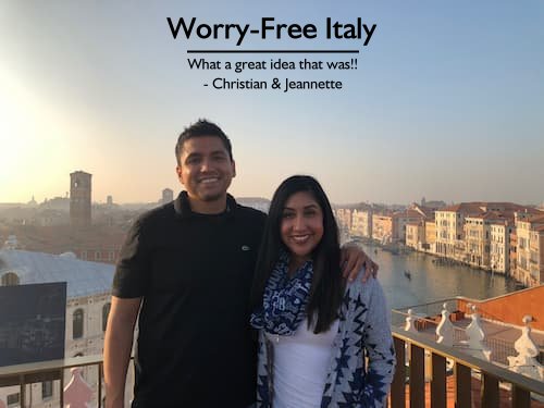 Happy couple on a rooftop in Venice, Italy, enjoying a worry-free honeymoon planned by Sheila Cannon.