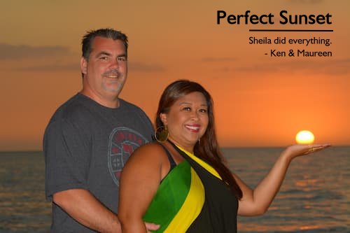 Couple enjoying sunset at Sandals Negril, Jamaica, planned by Sheila for their all-inclusive honeymoon, with the wife holding the setting sun in her hand.