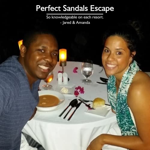 Jared & Amanda enjoying a romantic beach dinner on their honeymoon at Sandals Ochi, Jamaica, planned by Carefree Romantic Vacations.