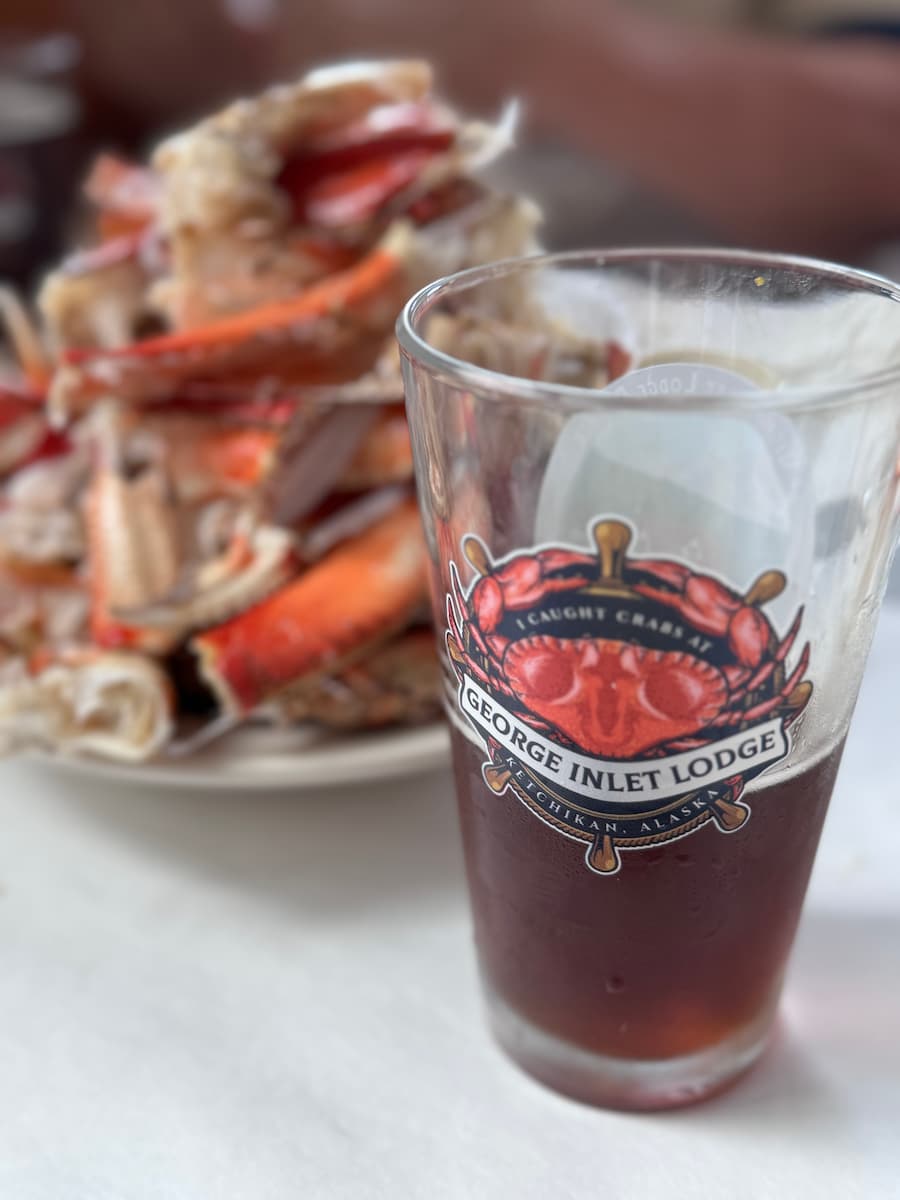 Local brew and emptied crab legs at George Inlet Lodge during the Alaska cruise adventure