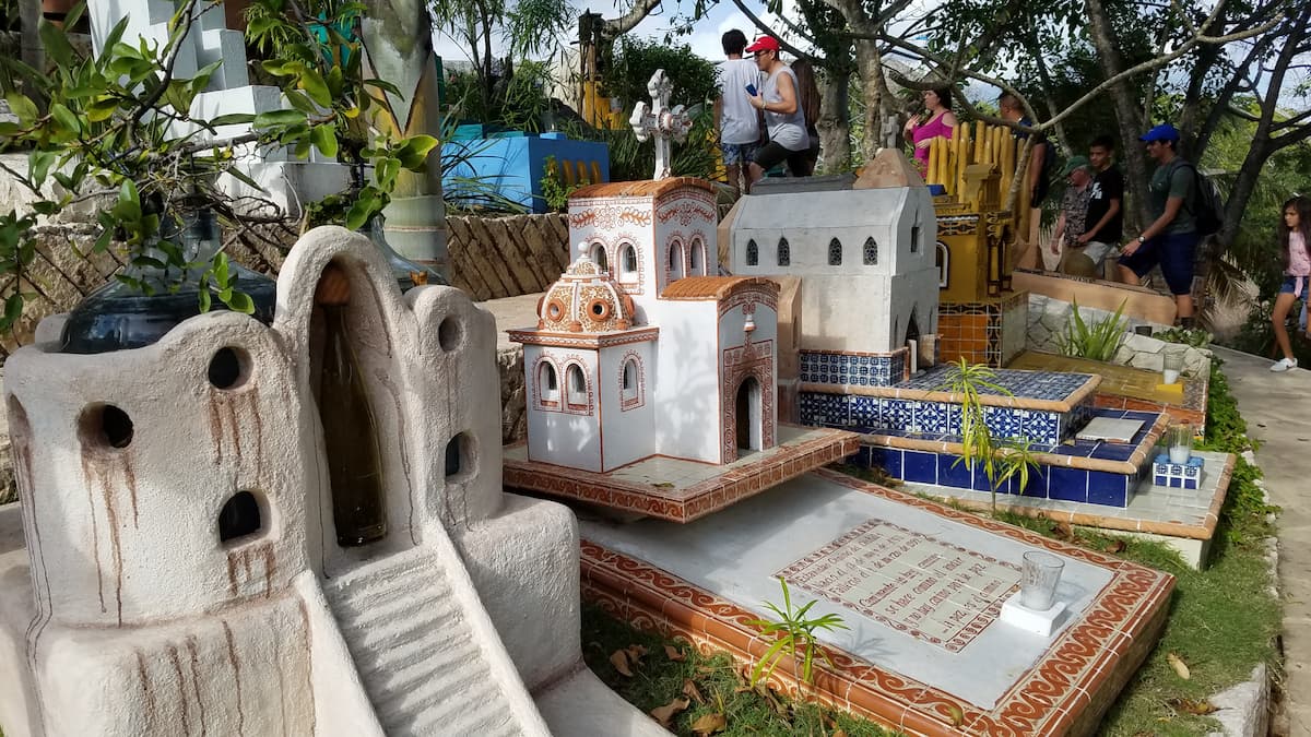 Tourists at the vibrant Mayan Cemetery in Xcaret Park.