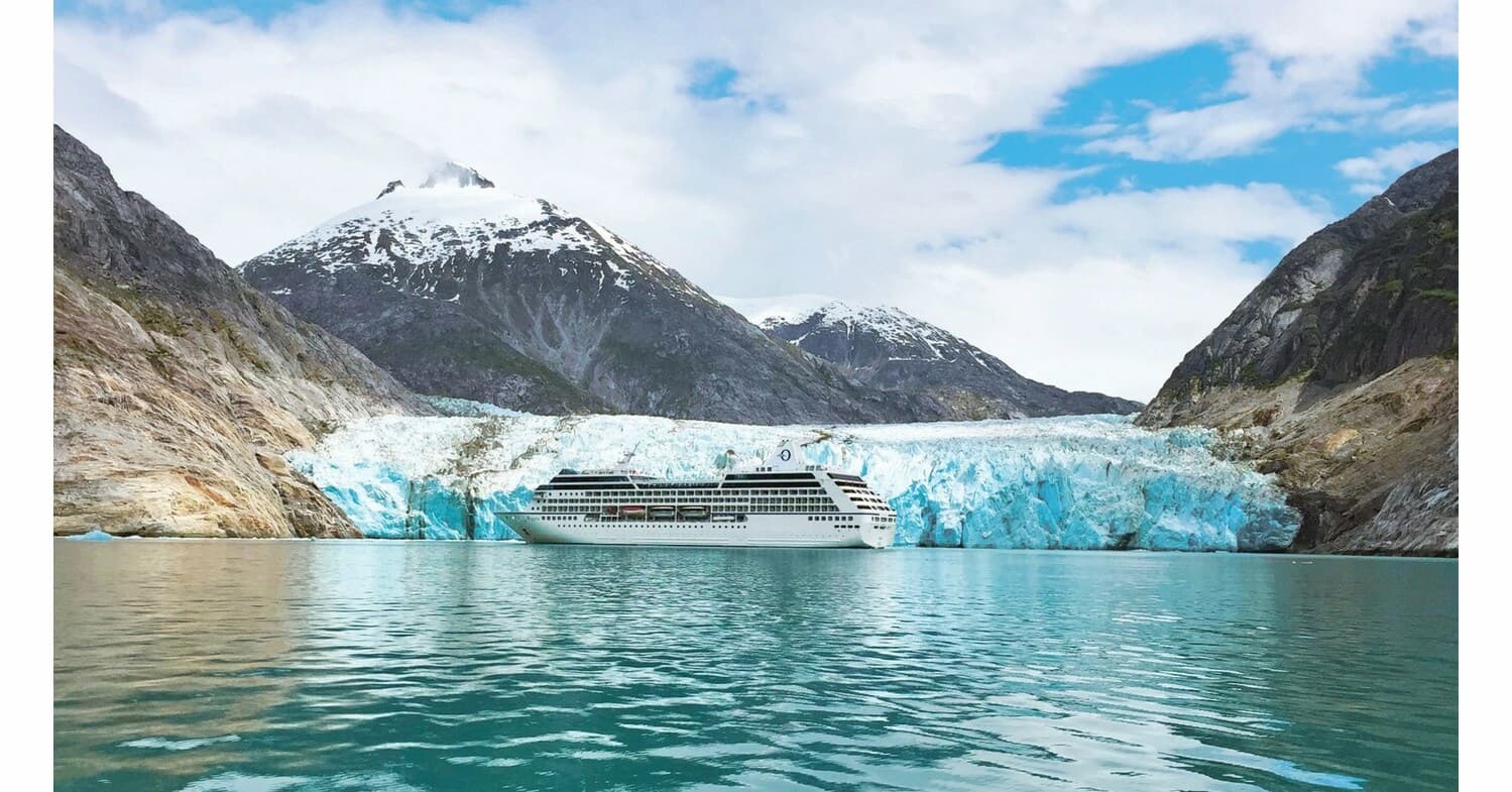 Oceania Regatta ship floating in front of the magnificent Hubbard Glacier during an Alaska cruise adventure.