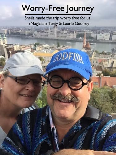 Terry and Laurie overlooking the Danube River with Prague in the background, enjoying their romantic Danube River cruise vacation planned by Sheila Cannon.