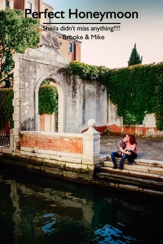 A couple kissing on the steps of a Venice canal during their perfect honeymoon in Italy planned by Sheila Cannon.